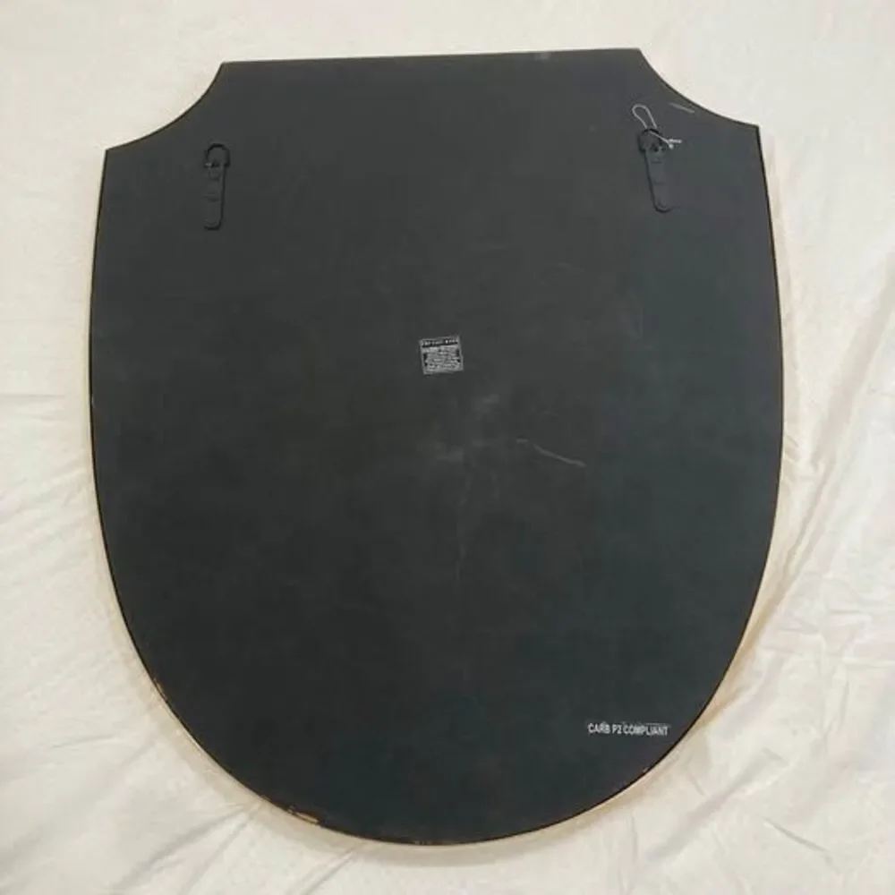 Pottery Barn brass shield shaped wall mirror
